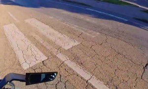 Motorcyclist Screams To The Beat As Car Enters Roundabout