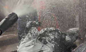 Biker Getting Sprayed in a Car Wash