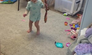 Little Girl Plays With a Big Snake