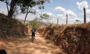 Two Cyclists Wipeout Going Around Curve