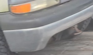 Truck Strapped Down Improperly on Trailer