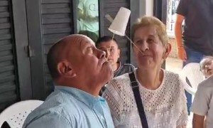 Grandma Trying Her Best at a Cup Game