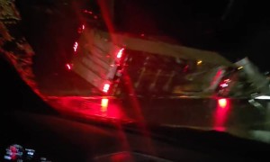 Semi Truck Slides Across Highway in Freezing Rain and Rolls Into Ditch