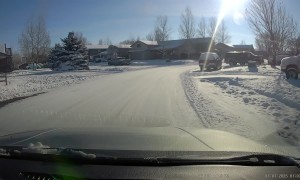 Neighborhood Teen Comically Slides Down Driveway Towards Oncoming Traffic