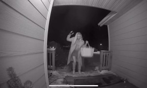 Husband Carries Wife Across Icy Sidewalk