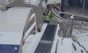Airplane Luggage Keeps Sliding Down Icy Conveyor Belt