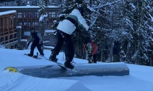 Snowboarder Face Plants After Hitting a Rail