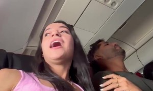 Woman Hugs Arm of Someone Else's Husband During Turbulence