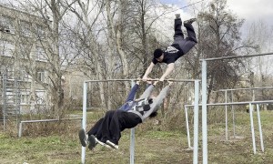 Three Person "Helicopter" on Horizontal Bar