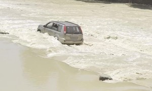 SUV Drives Through Crocodile-Infested Waters at Cahills Crossing