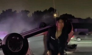 Woman Dances in Front of Her Flipped Tesla