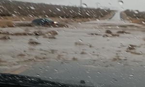 Car Attempts to Cross Floodwater and Gets Swept Away