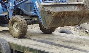 10-Year-Old Daughter Loading Tractor for Dad