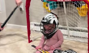 Older Brothers Playing Hockey Against Their 8 Month Old Sister