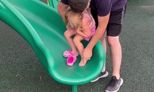 Daughter Falls Backward Off Slide Wall
