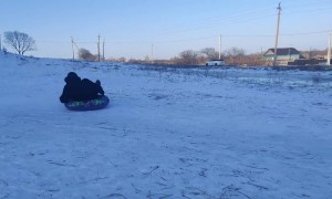 Sledding Man Slides Into Pole