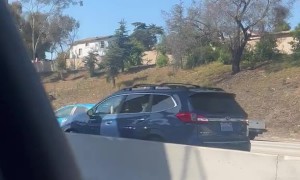Guy on Car Roof in LA Traffic