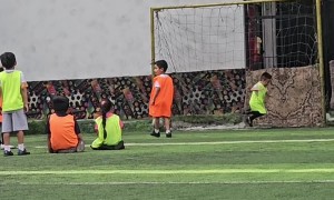Young Goalkeeper Dives to the Wrong Side