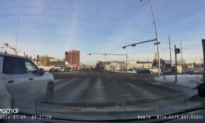 Apparent Red Light Runner Meets Conveniently-Placed Cop