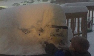 Little Boy Grabs Beer for His Dad in the Snow