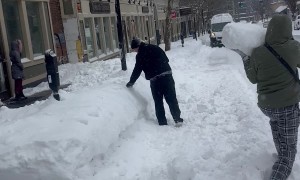 Large Snow Ball Knocks Guy Over