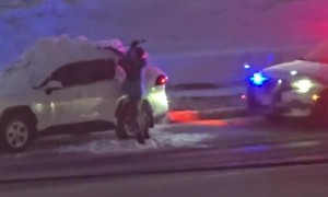 Driver Forced To Clean Snow Off Car