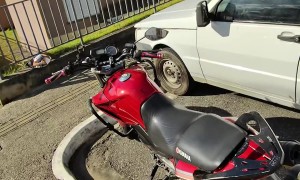 Boy Rides Bicycle Into Motorcycle's Tail