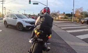 Inattentive Motorcyclist Nearly Hit By Turning SUV