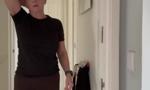 Woman Does Handstand Against an Open Door