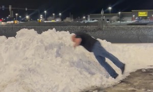 Guy Dives Head First Into Snow Mound