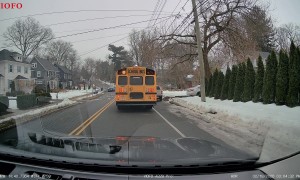 School Bus Drives Around a Stopped School Bus