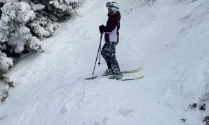 Girl Sliding Down Double Black Ski Run