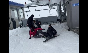 Friends All Fall Exiting The Ski Lift
