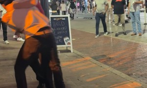 Woman Gets Thrown Aside During Street Fight