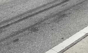 Man Stuck in Drainage Ditch Next to Highway