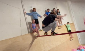 Ninja Runs Up Wall And Lands On Gymnastics Bar