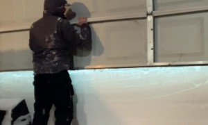 Garage Doorway Completely Blocked by Wall of Snow