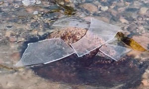 Satisfying Icy Water Breaking on a Rock