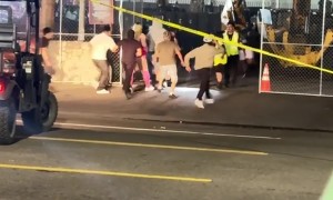 Ravers Rush Past Security at Beyond Wonderland SoCal 2026