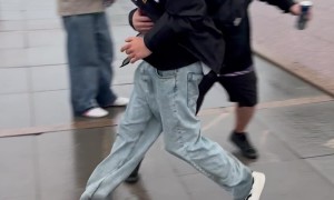 Man Drops Beer Trying to  Catch His Friend