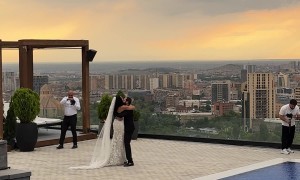 Couple Falls Over When Groom Gets Tangled In Bride's Long Veil