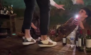 Man Stumbles Off Dinner Table at Party