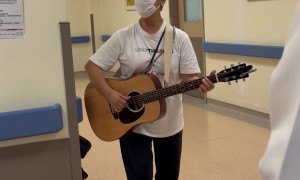 Elderly Woman Sings for Patients and Staff at a Hospital
