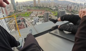Guy Saves Friend From Slipping Off Roof