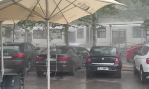 Stormy Winds Push Umbrella Into Car