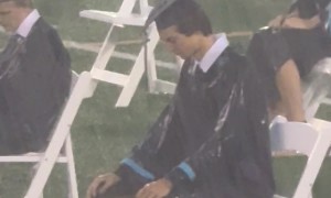 Dystopian Outdoor Graduation in Heavy Downpour