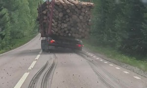 Timber Truck Lets Logs Spill Onto Road