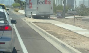 Mail Driver Drives On Sidewalk Dirt