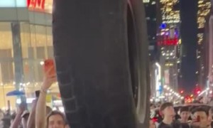 NYC Icon Leh-Boy Celebrates Knicks Win With Tire Balanced On Head