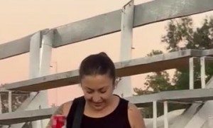 Woman Loses Balance and Takes a Slow Fall